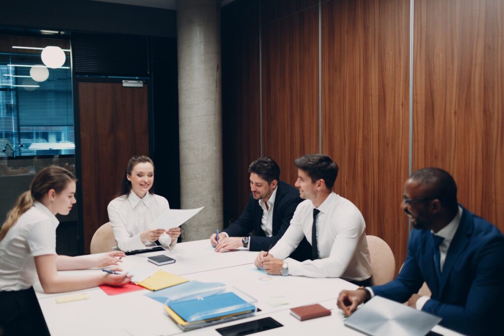 Business team in a meeting discussing documents-Executive Workshops in Macon, GA

