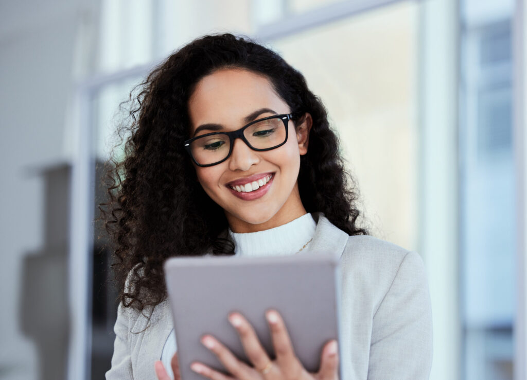 Smiling businesswoman using a digital tablet-Thought Leadership in Columbus, GA
